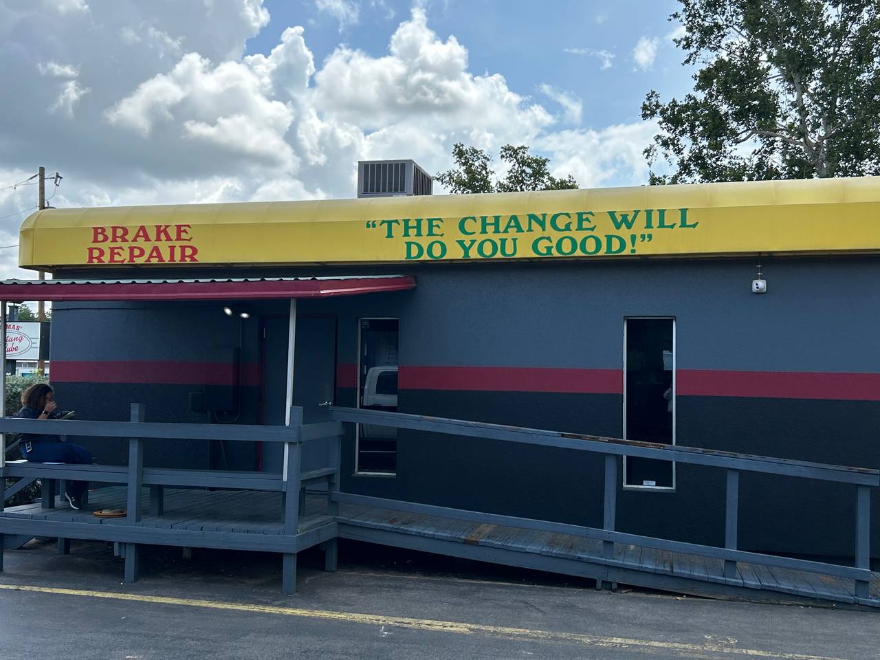 Brake repair signage on the awning outside Thomas' Mustang Lube & Auto Repair in Kingsland, TX