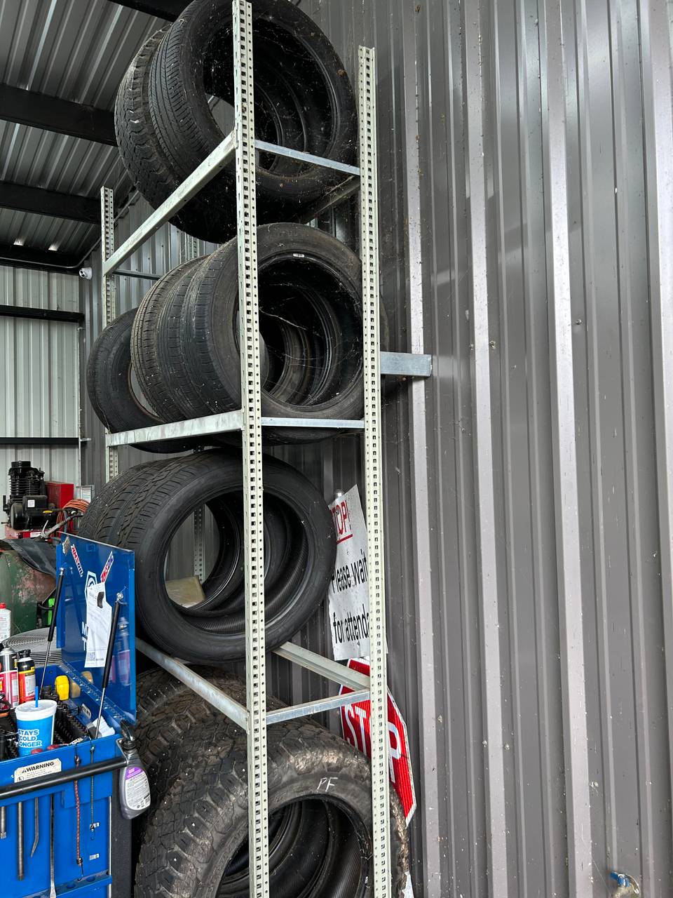 Tire inventory stocked on shelving at Thomas' Mustang Lube & Auto Repair in Kingsland, TX